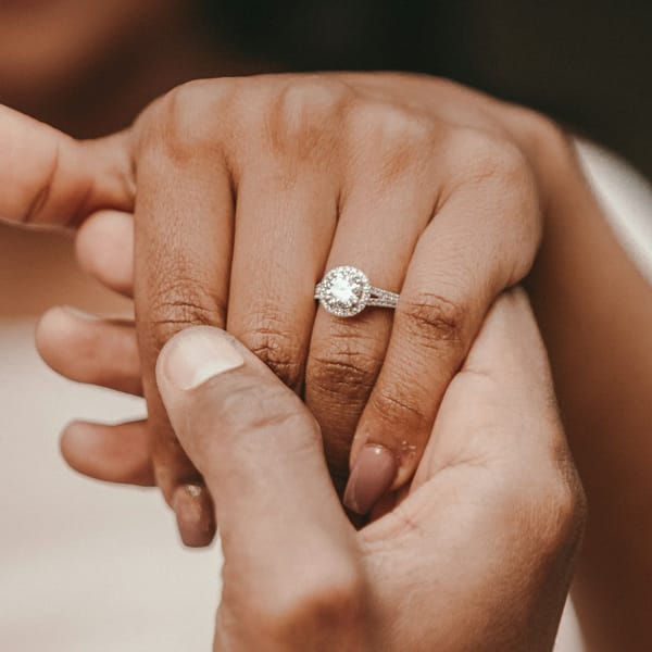 Close-up of a halo diamond engagement ring